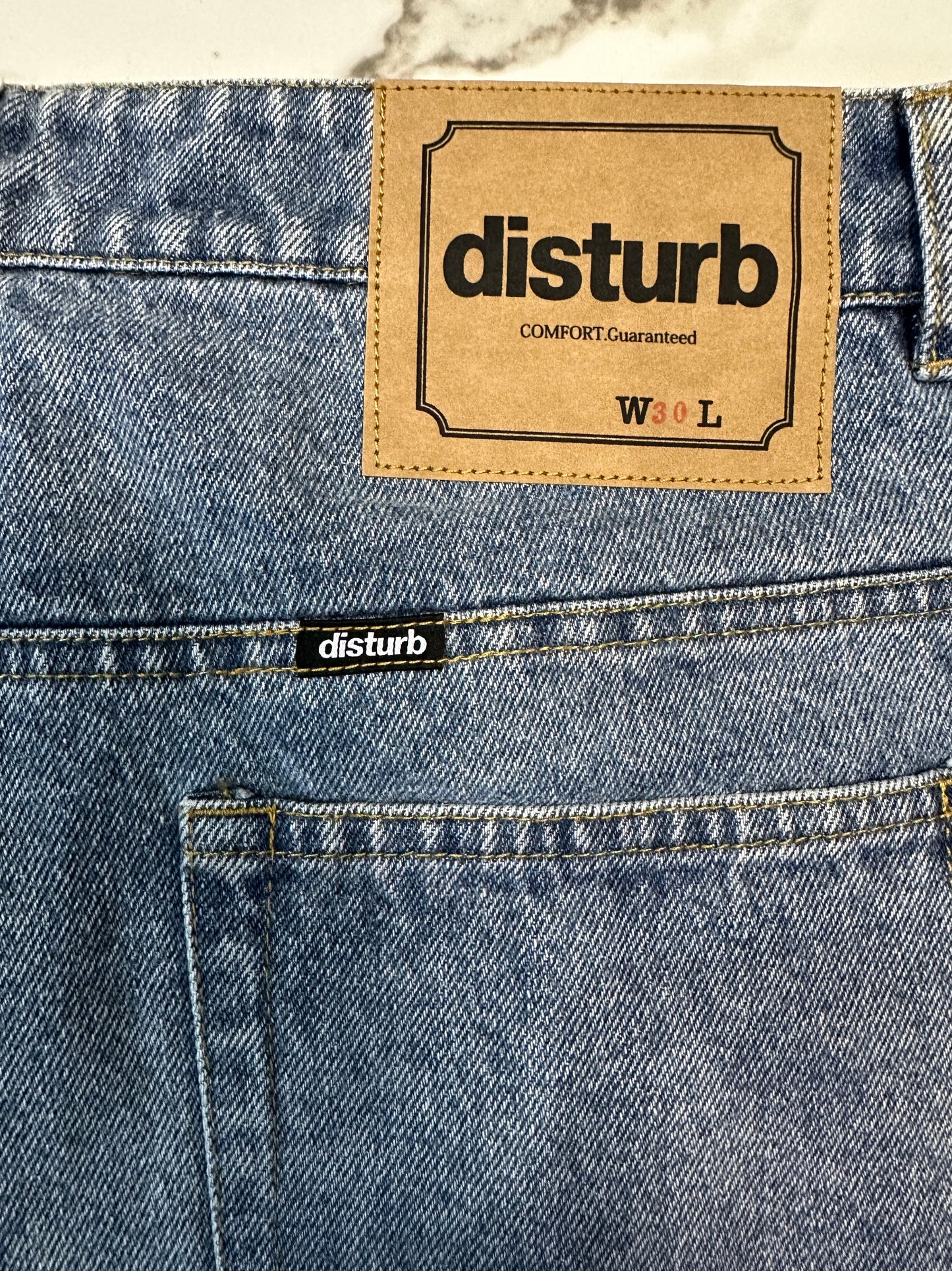 Denim jorts “disturb” front logo